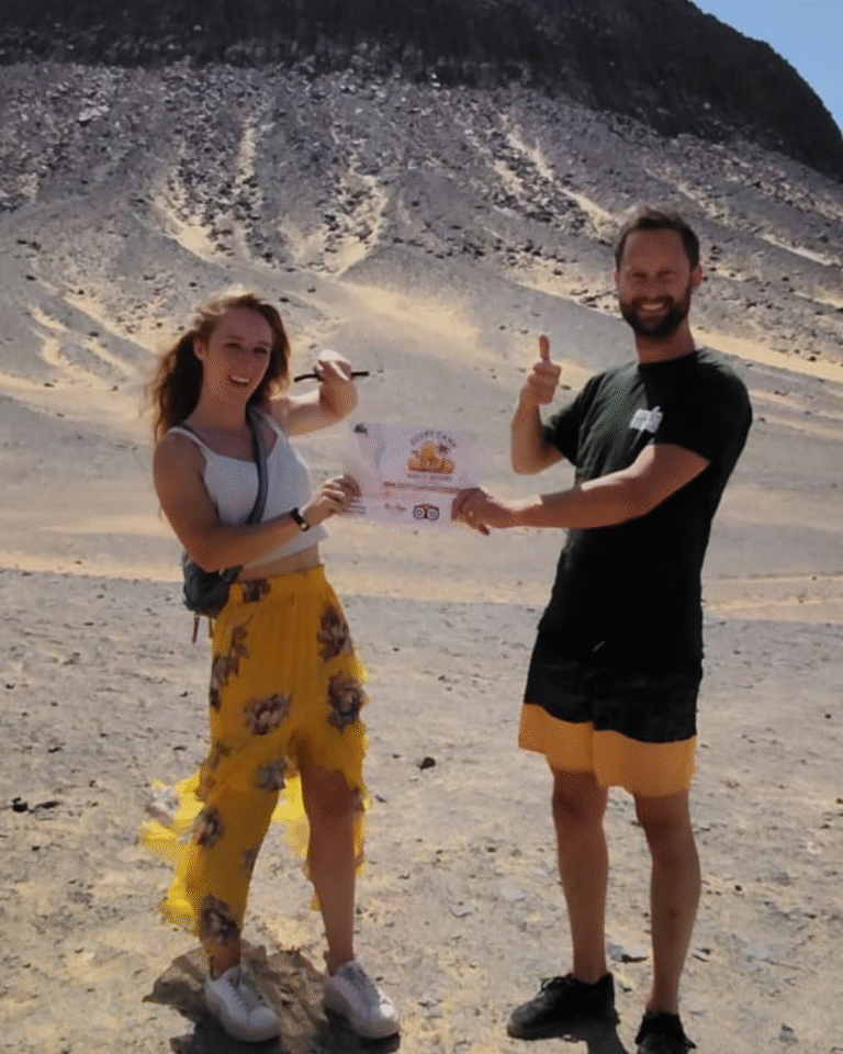 Black Desert Egypt tours– Egypt Camp White Desert travelers exploring volcanic mountains