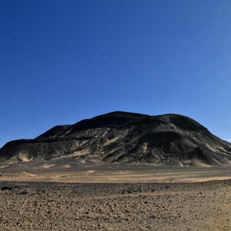 Black Desert volcano-like landscape under golden sunset