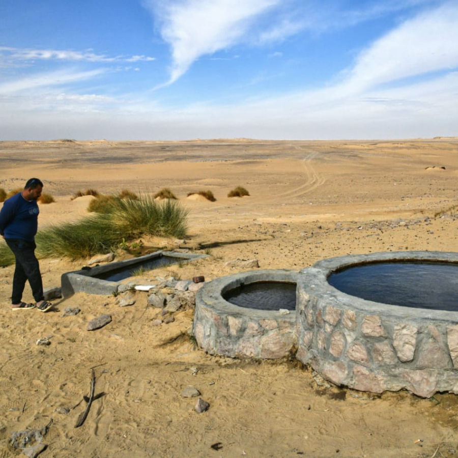 Tourist taking photos in Egypt’s White Desert safari